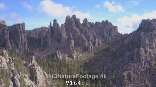 Aerial Drone Flying Over Pine Forest and Granite Outcroppings in Black Hills