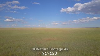 Aerial Drone Moving over Flat Vast Grassland Prairie South Dakota in in Summer